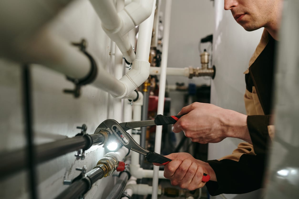 Plumbers maintaining commercial plumbing pipes in Haines City